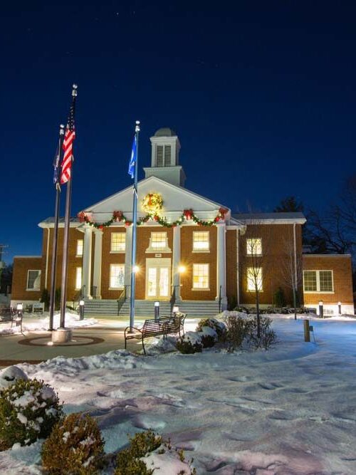 Purcellville town hall with lighted tree and snow