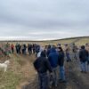 Participants in grape pruning workshop gather outdoors